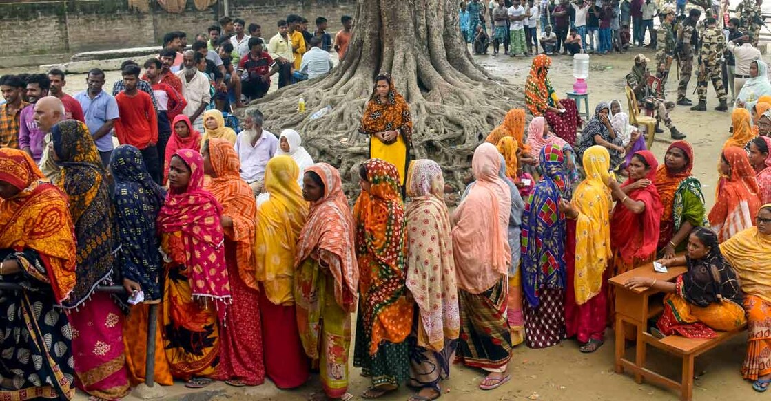 Voters wait in queue at a polling booth during Panchayat repolls, in Murshidabad district, Monday, July 10, 2023. Photo; PTI