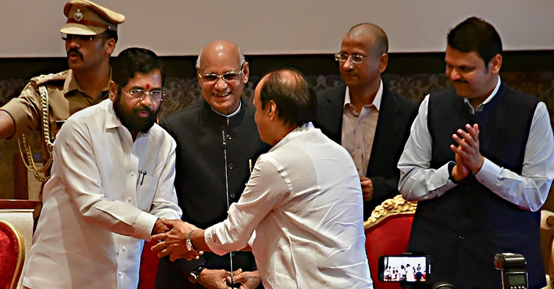 Maharashtra Chief Minister Eknath Shinde congratulates the newly sworn-in Deputy Chief Minister Ajit Pawar, during a ceremony at Raj Bhavan. Photo: PTI