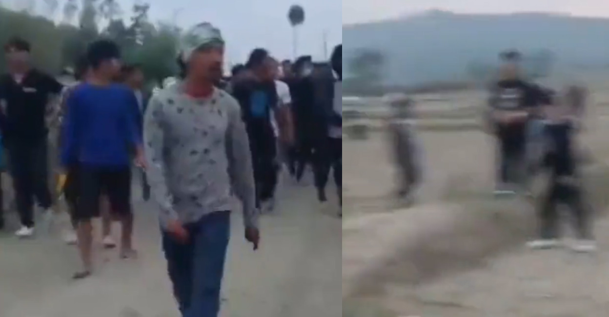 Two women from one of the warring communities in Manipur being paraded naked by a few men. Photo: @KKOjhaIND/ Twitter