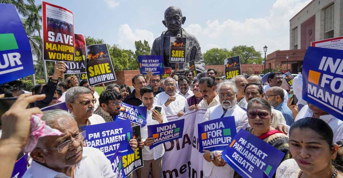 Congress President and Leader of the Opposition in Rajya Sabha Mallikarjun Kharge with other leaders of the INDIA alliance parties stage a protest over ethnic violence in Manipur during Monsoon session of Parliament, in New Delhi, Monday, July 24, 2023. Photo: PTI