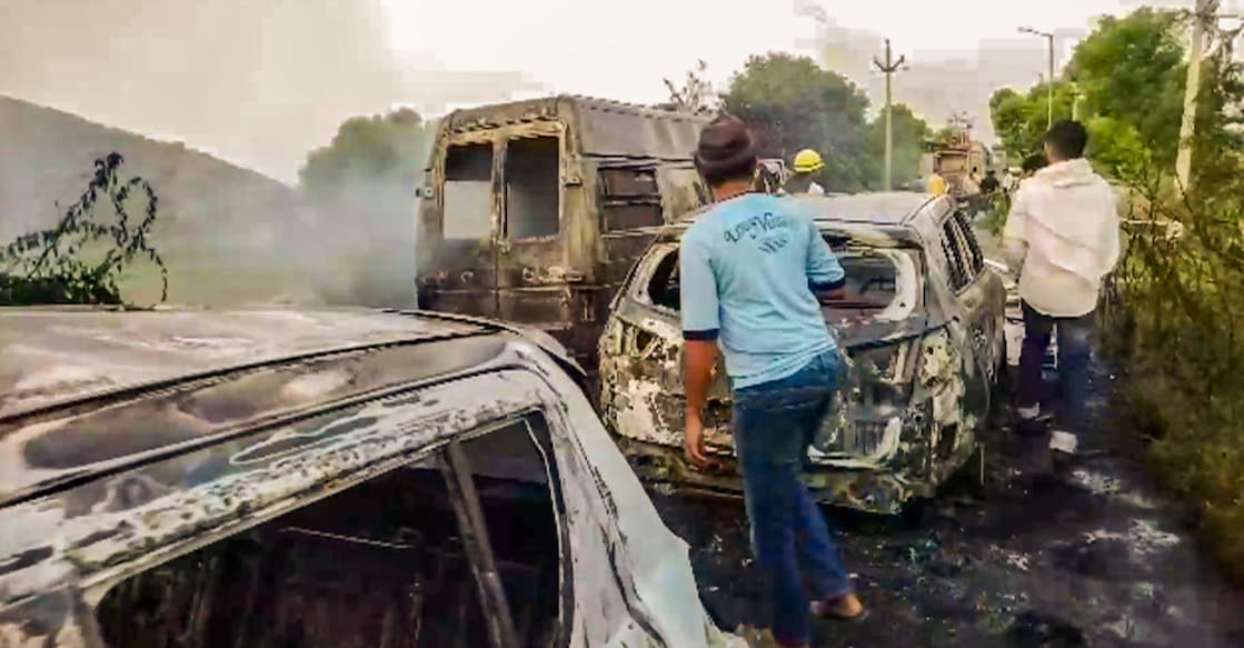 People inspect the vehicles set on fire during clashes that broke out during a 'Brij Mandal Jalabhishek Yatra', in Nuh, Haryana on Monday. Photo: PTI