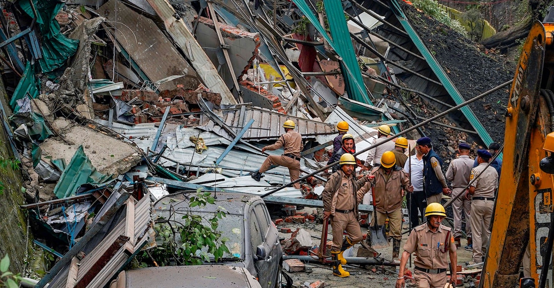 Rescue operations in Shimla after several houses and a slaughterhouse collapsed in a landslide on Tuesday. Photo: PTI
