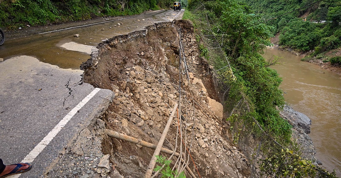 A section of the Chandigarh-Manali highway is seen damaged after a landslide, near Mandi on Wednesday. Photo: PTI/ Jai Kumar