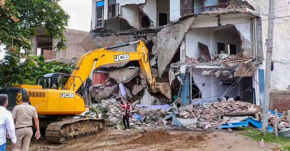 PTI08_06_2023_000053B This is the fourth day of demolition drive in Nuh with the district administration saying they have identified 16 illegal structures which will be bulldozed on Sunday. Photo: PTI