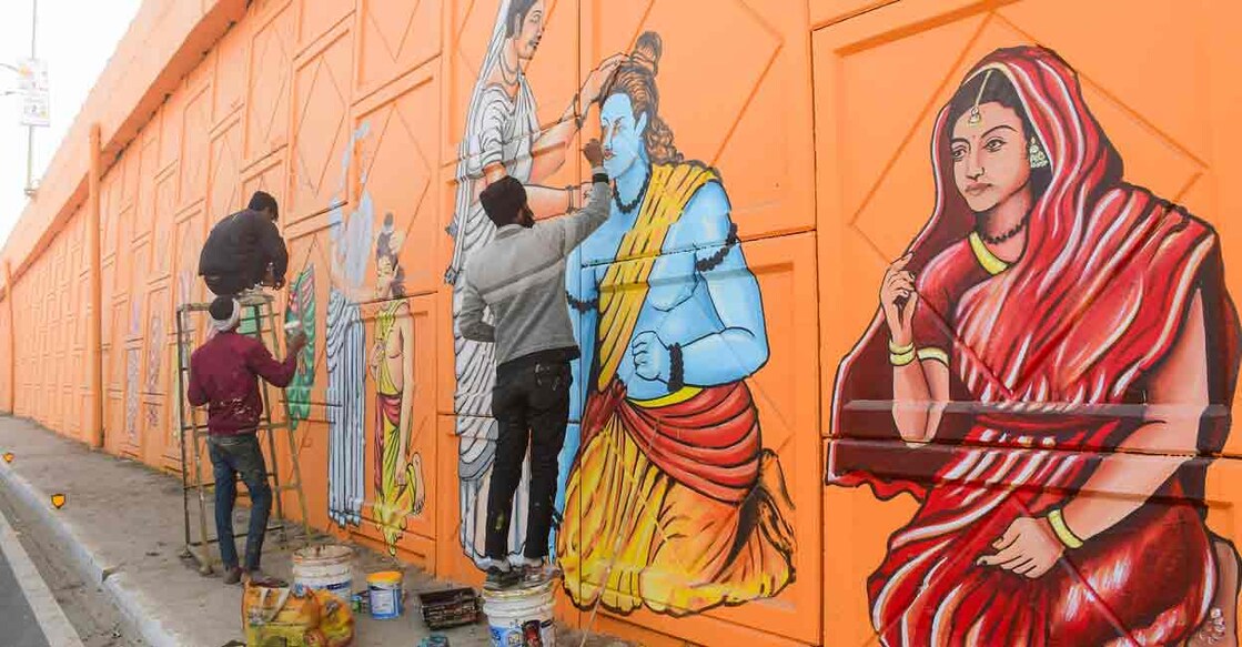 Artists make a graffiti depicting Lord Ram and Goddess Sita on the wall of an overbridge ahead of the Jan. 22 consecration of the Ram Mandir, in Ayodhya, Monday, Jan. 8, 2024. Photo: PTI