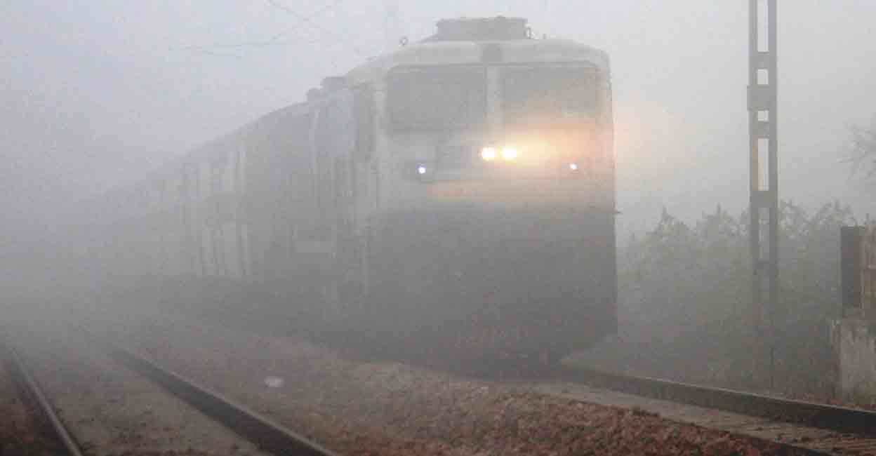 A train runs amid low visibility due to dense fog, in Gurugram, Monday, Jan. 15, 2024. Photo: PTI
