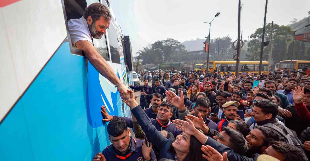 PTI01_23_2024_000388B Congress leader Rahul Gandhi shakes hand with supporters during the 'Bharat Jodo Nyay Yatra', in Barpeta, Assam, Tuesday, Jan. 23, 2024. Photo: PTI