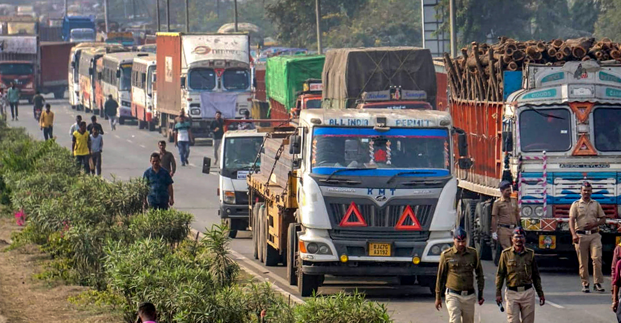 PTI01_02_2024_000051B Trucks parked on a highway amid 'rasta roko' protest by truck drivers, in Nagpur on Tuesday. Photo: PTI