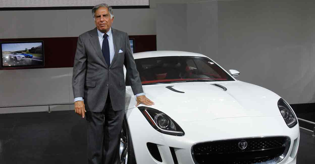 INDIA-TATA Chairman of Tata Group Ratan Tata poses with Jaguar's newly launched C-X16 car during India's Auto Expo, in New Delhi January 5, 2012. File photo: REUTERS/Adnan Abidi
