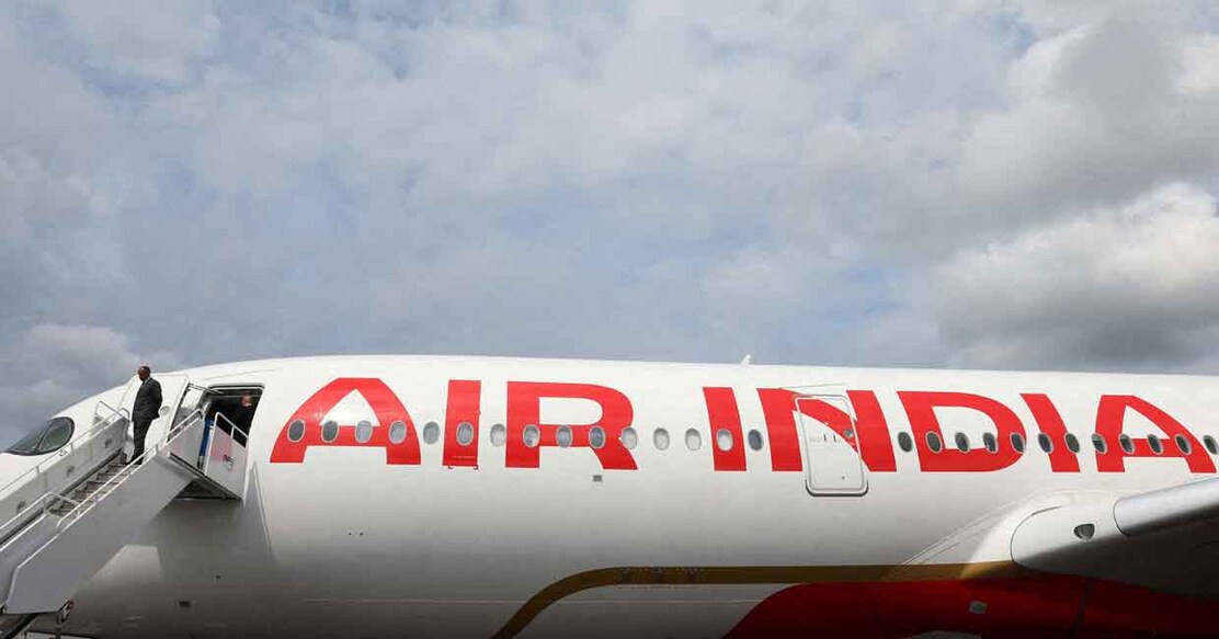 FILE PHOTO: Branding for Air India is seen on an Airbus A350-900 at the Farnborough International Airshow, in Farnborough, Britain, July 24, 2024. REUTERS/Toby Melville/File Photo/File Photo