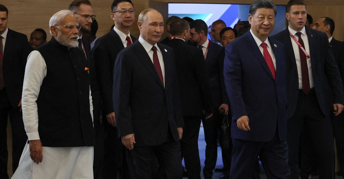 Indian Prime Minister Narendra Modi, Russian President Vladimir Putin and Chinese President Xi Jinping arrive for a family photo during the BRICS summit in Kazan on October 23, 2024.Photo:AFP/ MAXIM SHIPENKOV