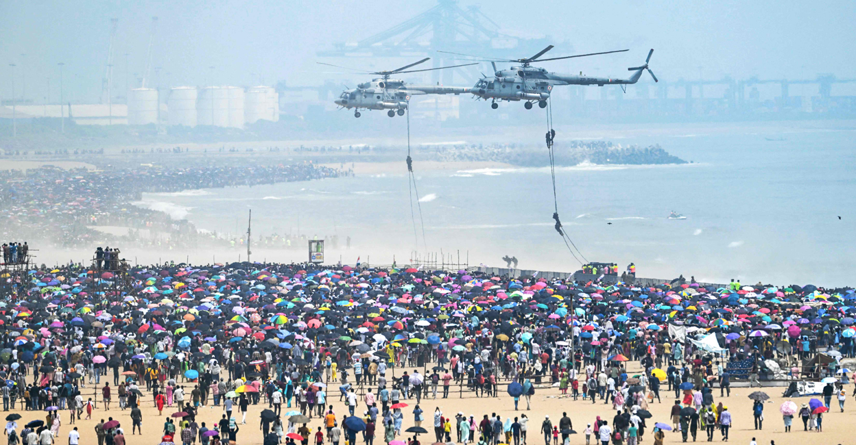 Indian Air Force (IAF) helicopters perform during an airshow ahead of the Indian Air Force Day celebrations at Marina Beach in Chennai on October 6, 2024. PTI: R Satish BABU / AFP