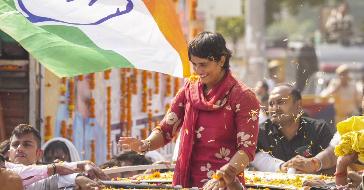 vinesh-phogat-ls Congress candidate Vinesh Phogat greets supporters during her victory celebration after winning from Julana constituency in the Haryana Assembly elections, in Jind district, Haryana, Tuesday, Oct. 8, 2024. Photo: PTI.