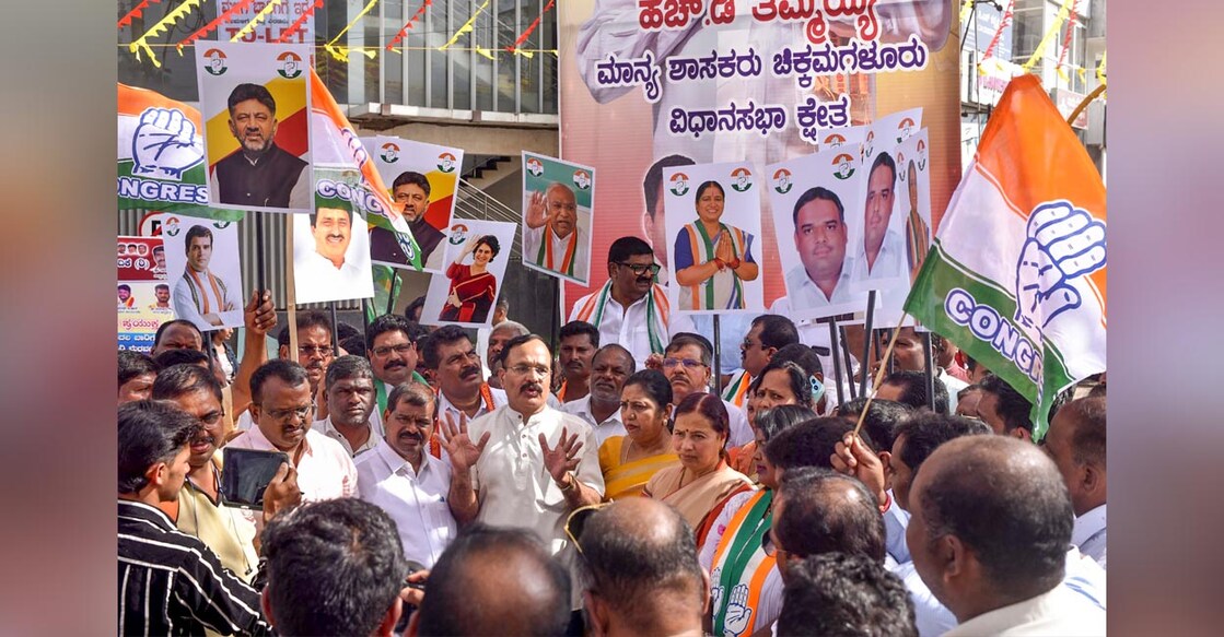 karnataka bypoll Congress workers celebrate their victory in Karnataka Assembly by-elections in Chikmagalur. Photo: PTI