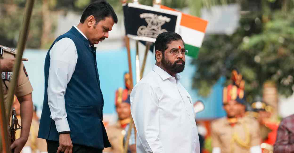 Maharashtra Chief Minister Eknath Shinde and Deputy Chief Minister Devendra Fadnavis after paying tribute to martyrs of the 2008 Mumbai terror attacks, on the anniversary of the gruesome incident, at CP office in Mumbai, Tuesday, Nov. 26, 2024. Photo: PTI