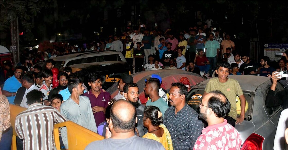 Locals gather at the spot after a BEST bus collided with several vehicles in Kurla, Mumbai. Photo: PTI