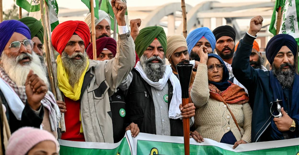 Farmers shouting slogans march during a protest against the central government demanding minimum support price (MSP) for their crops, in Amritsar . Photo: AFP