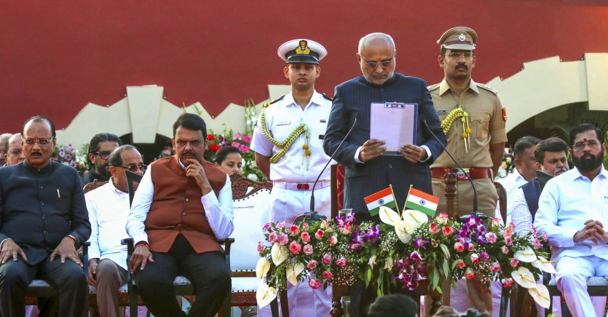 Maharashtra Governor CP Radhakrishnan, Chief Minister Devendra Fadnavis, Deputy Chief Ministers Ajit Pawar and Eknath Shinde and others during the swearing-in ceremony of cabinet ministers at Raj Bhavan, in Nagpur. Photo: PTI
