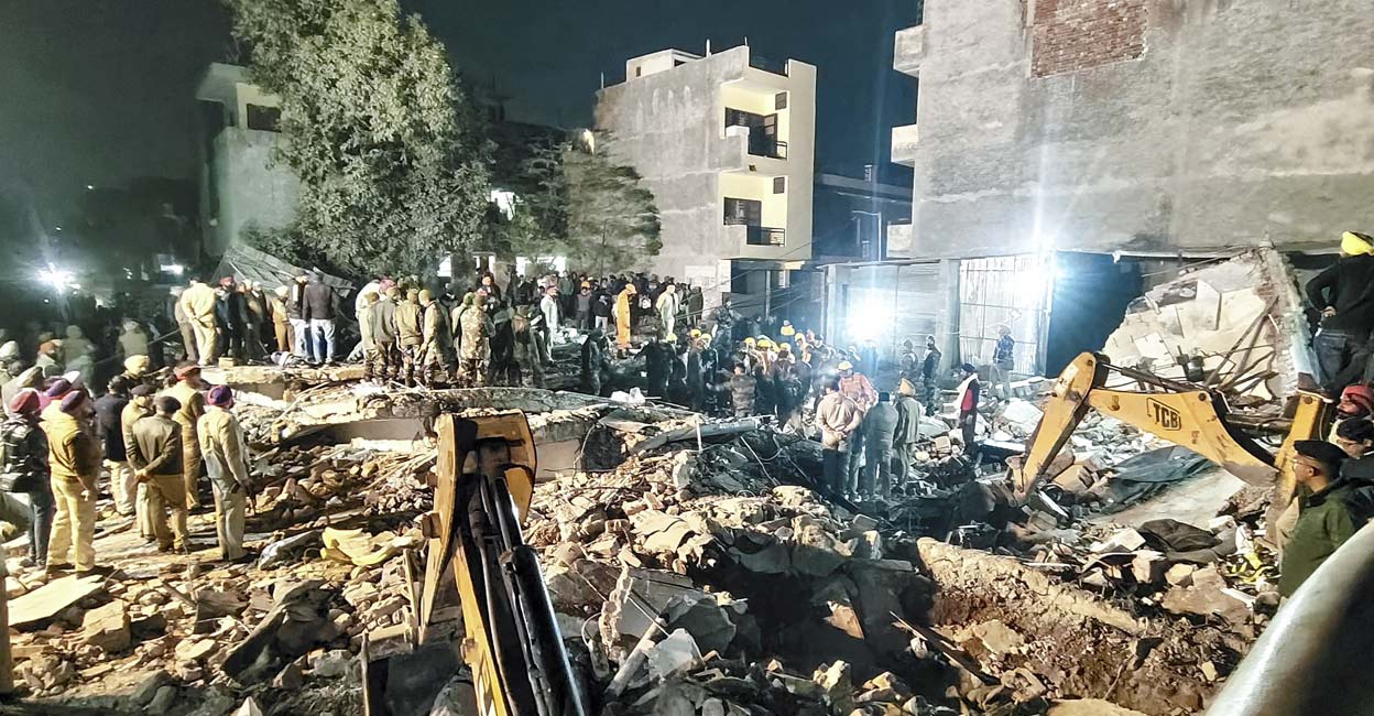 Police personnel at the spot after a multi-storey building collapsed in Mohali. Photo: PTI