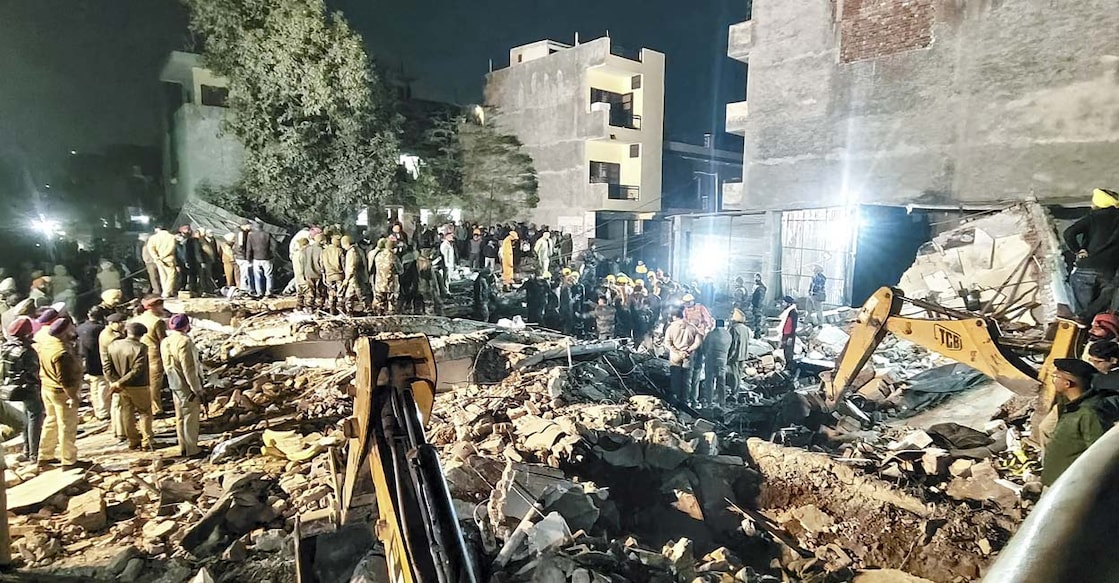 mohali-building-collapse Police personnel at the spot after a multi-storey building collapsed in Mohali. Photo: PTI