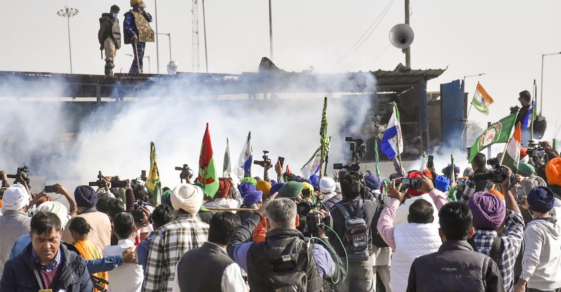 farmers protest Tear gas is being used by security personnel to disperse the farmers moving towards barricades during their foot march to Delhi at the Shambhu border. Photo: PTI/Shiva Sharma