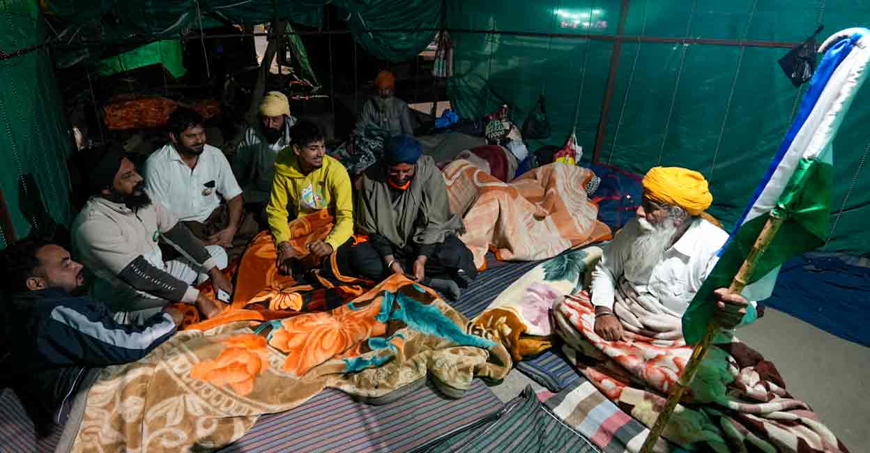 PTI12_05_2024_000452A Farmers gather at a makeshift shelter at the Shambhu border ahead of their proposed march to the national capital on December 6, near Patiala, Thursday, Dec. 5, 2024. Photo: PTI