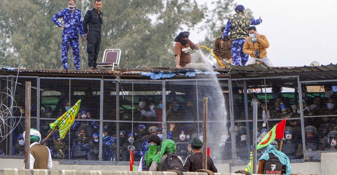 Police use water cannons to disperse farmers protesting at Shambhu border on Sunday. Photo: PTI/Shiva Sharma
