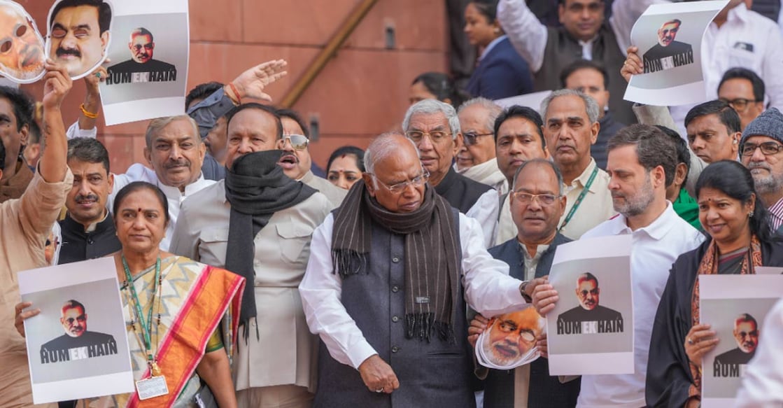 LoP in the Rajya Sabha Mallikarjun Kharge with LoP in the Lok Sabha Rahul Gandhi and other opposition MPs stages a protest over the Adani issue and Manipur unrest during the Winter session of Parliament, in New Delhi, Monday, Dec. 9, 2024. Photo: PTI. 