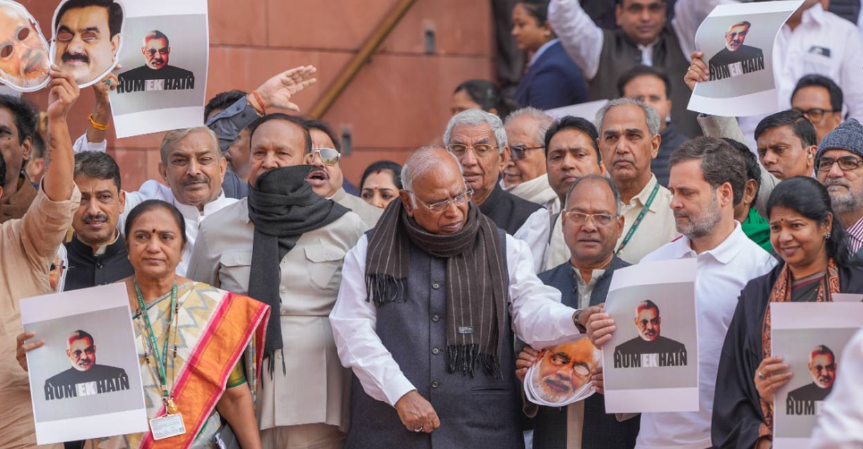 LoP in the Rajya Sabha Mallikarjun Kharge with LoP in the Lok Sabha Rahul Gandhi and other opposition MPs stages a protest over the Adani issue and Manipur unrest during the Winter session of Parliament, in New Delhi, Monday, Dec. 9, 2024. Photo: PTI. 
