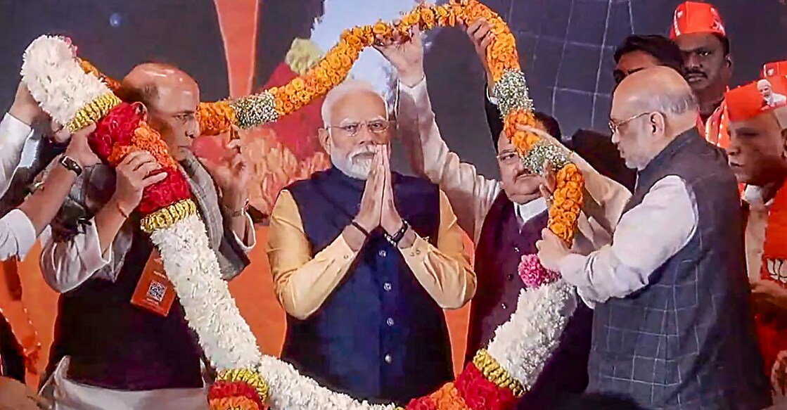 Prime Minister Narendra Modi being garlanded by Union Home Minister Amit Shah, Union Defence Minister Rajnath Singh, BJP National President JP Nadda and others during the BJP National Council Meeting on its second day, at the Bharat Mandapam, in New Delhi. Photo: PTI.