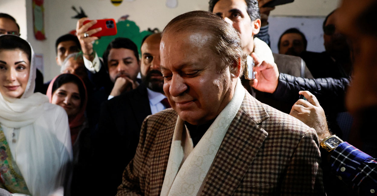 pak-elections-ls Former Prime Minister Nawaz Sharif smiles on the day he casts his vote at a polling station during the general election in Lahore, Pakistan. Photo: Reuters.