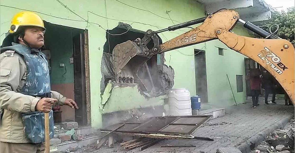PTI02_08_2024_000403A Heavy machinery being used to demolish an "illegally built" madrasa at Banbhoolpura area, in Haldwani, Uttarakhand, Thursday, Feb. 8, 2024. Photo: PTI