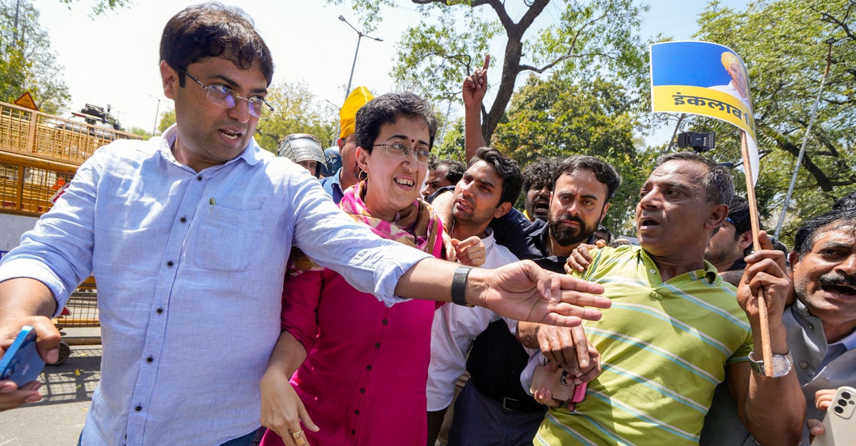 PTI03_23_2024_000065A Delhi Minister and AAP leader Atishi Singh with party workers and supporters at Shaheedi Park during a protest over the arrest of Delhi Chief Minister Arvind Kejriwal in connection with an excise policy-linked money-laundering case, in New Delhi on Saturday. Photo: PTI
