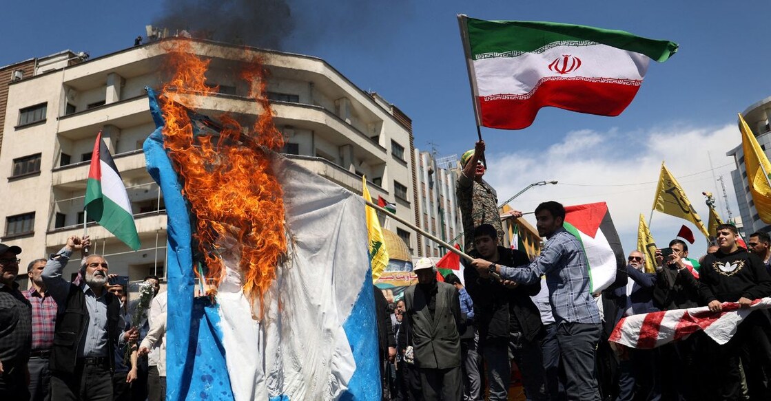 Iranians burn an Israeli flag during a rally marking Quds Day and the funeral of members of the Islamic Revolutionary Guard Corps who were killed in a suspected Israeli airstrike on the Iranian embassy complex in the Syrian capital Damascus, in Tehran, Iran, April 5, 2024. Photo: Majid Asgaripour/West Asia News Agency/Reuters