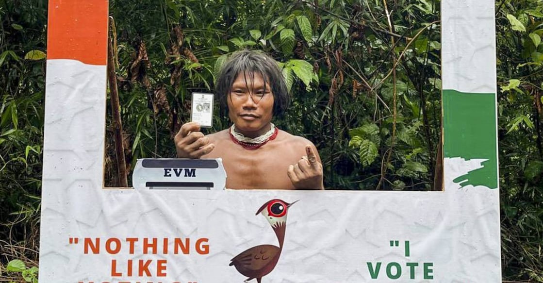  A voter from the Shompen tribal community poses for a photo after casting his vote for the first phase of Lok Sabhaelections in Andaman and Nicobar Island. Photo: PTI