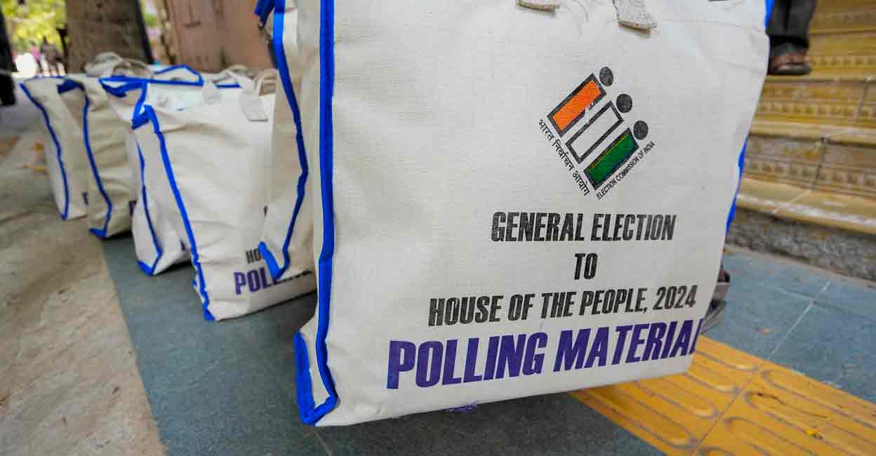 Electronic Voting Machines (EVM) and other election material being distributed from Nandanam Arts college to the respective polling booths on the eve of the first phase of Lok Sabha elections, in Chennai, Thursday, April 18, 2024. Photo: PTI