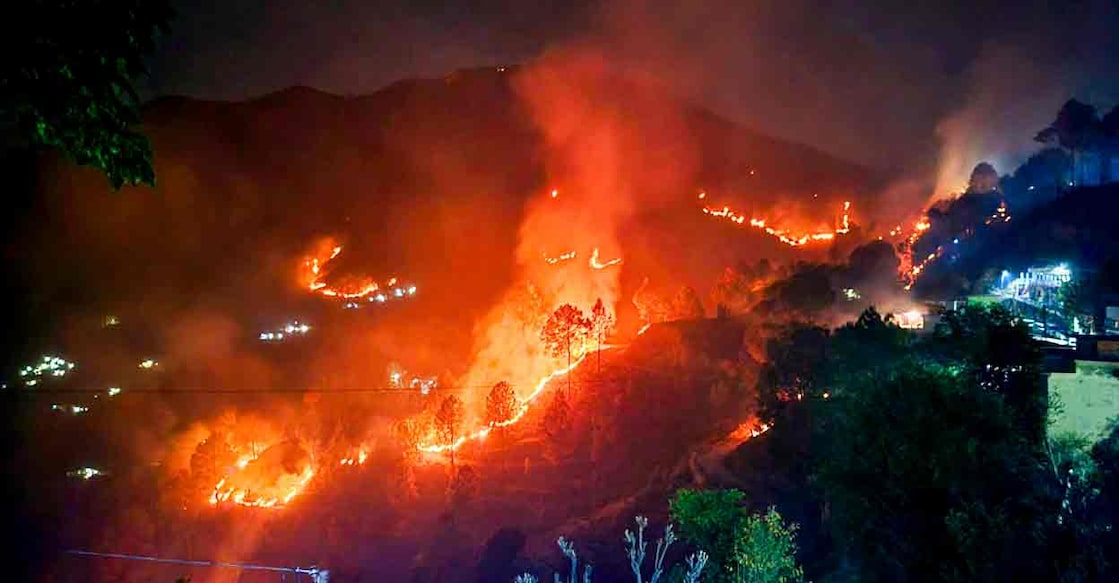 Flames rise during a forest fire near Saterakhal village, in Rudraprayag district, Wednesday, April 24, 2024. Photo: PTI