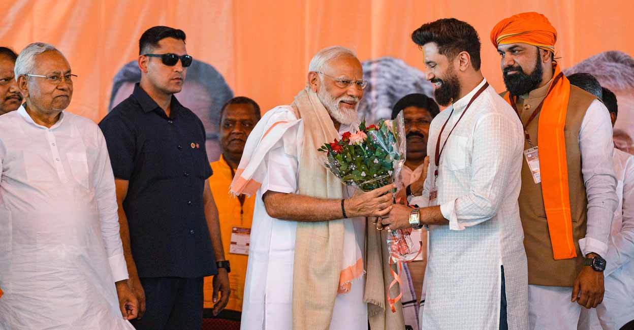 Jamui: Prime Minister Narendra Modi with Bihar Chief Minister Nitish Kumar, Deputy Chief Minister Samrat Chaudhary and Lok Janshakti (Ram Vilas) chief Chirag Paswan during a public meeting ahead of Lok Sabha elections, in Jamui, Thursday, April 4, 2024. (PTI Photo)(PTI04_04_2024_000105A)