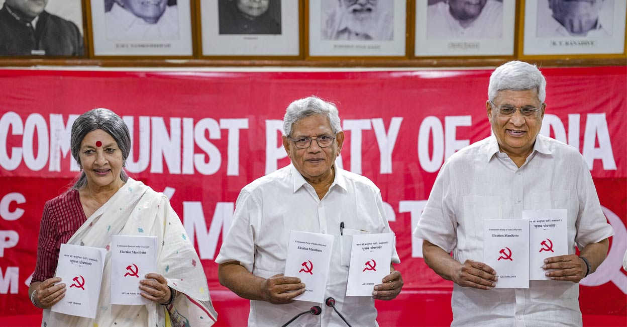CPI(M) General Secretary Sitaram Yechury with Polit Bureau members Prakash Karat and Brinda Karat with the party's manifesto for the Lok Sabha elections. Photo: PTI. 