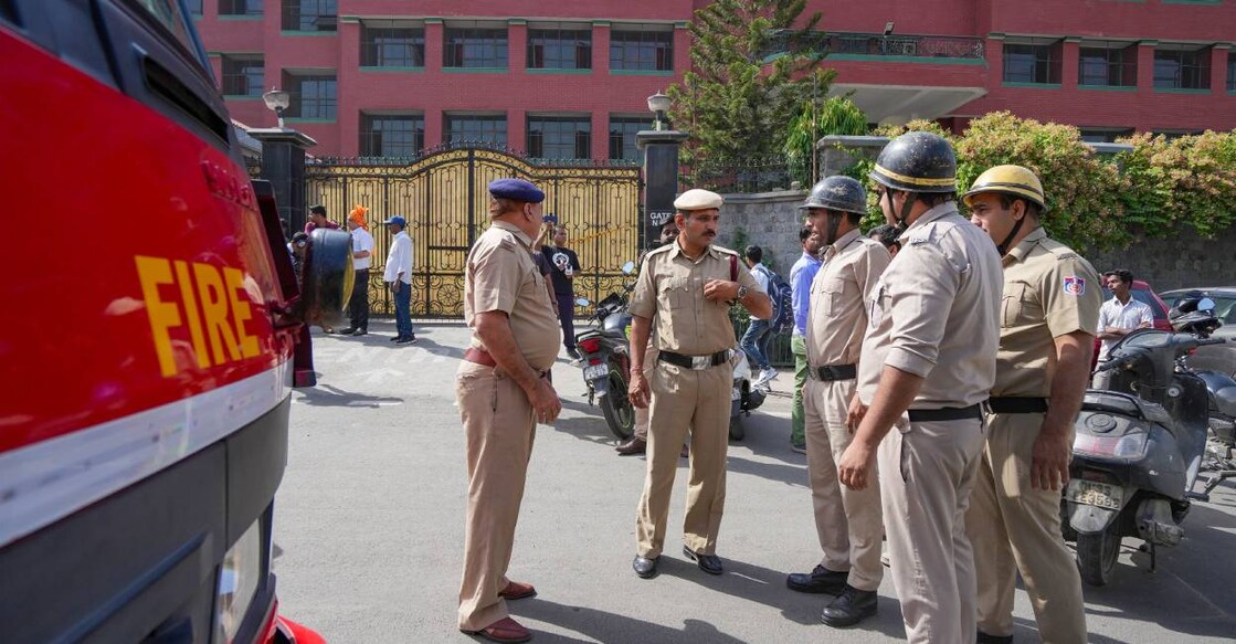 delhi-bomb-threat-c Police and fire department personnel outside Mother Marys School at Mayur Vihar. Photo: PTI