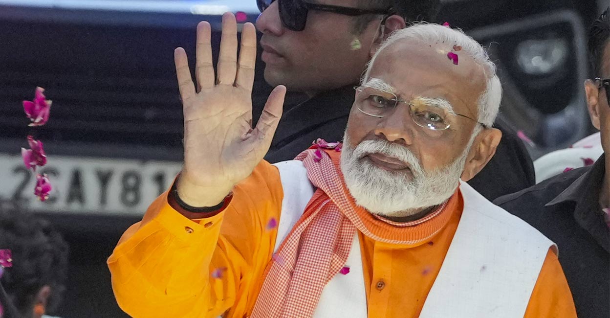 Prime Minister Narendra Modi during a road show for Lok Sabha elections in Varanasi on Monday, May 13, 2024. File Photo: PTI. 