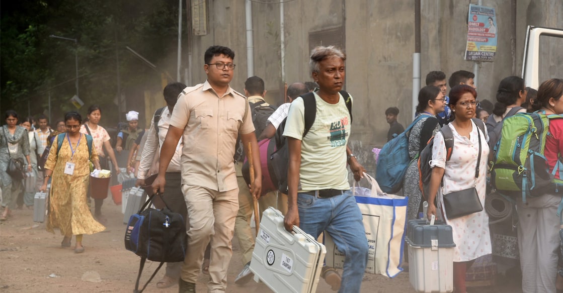 Polling officials leaving for their respective polling booths on the eve of phase 5 of the LS elections in West Bengal. Photo: PTI.
