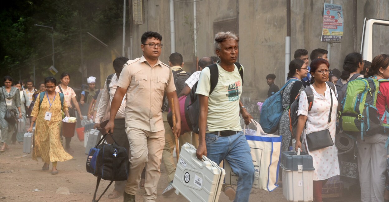 Polling officials leaving for their respective polling booths on the eve of phase 5 of the LS elections in West Bengal. Photo: PTI.
