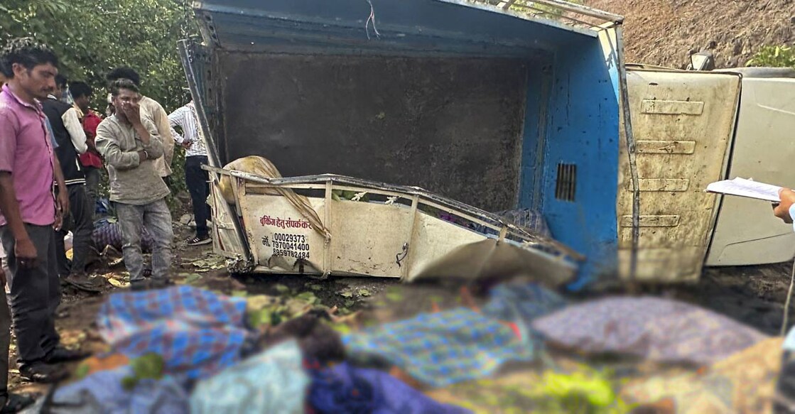 Locals near the site of an accident where a mini goods vehicle plunged into a gorge, in Kabirdham district, Monday, May 20, 2024. Photo: PTI. 