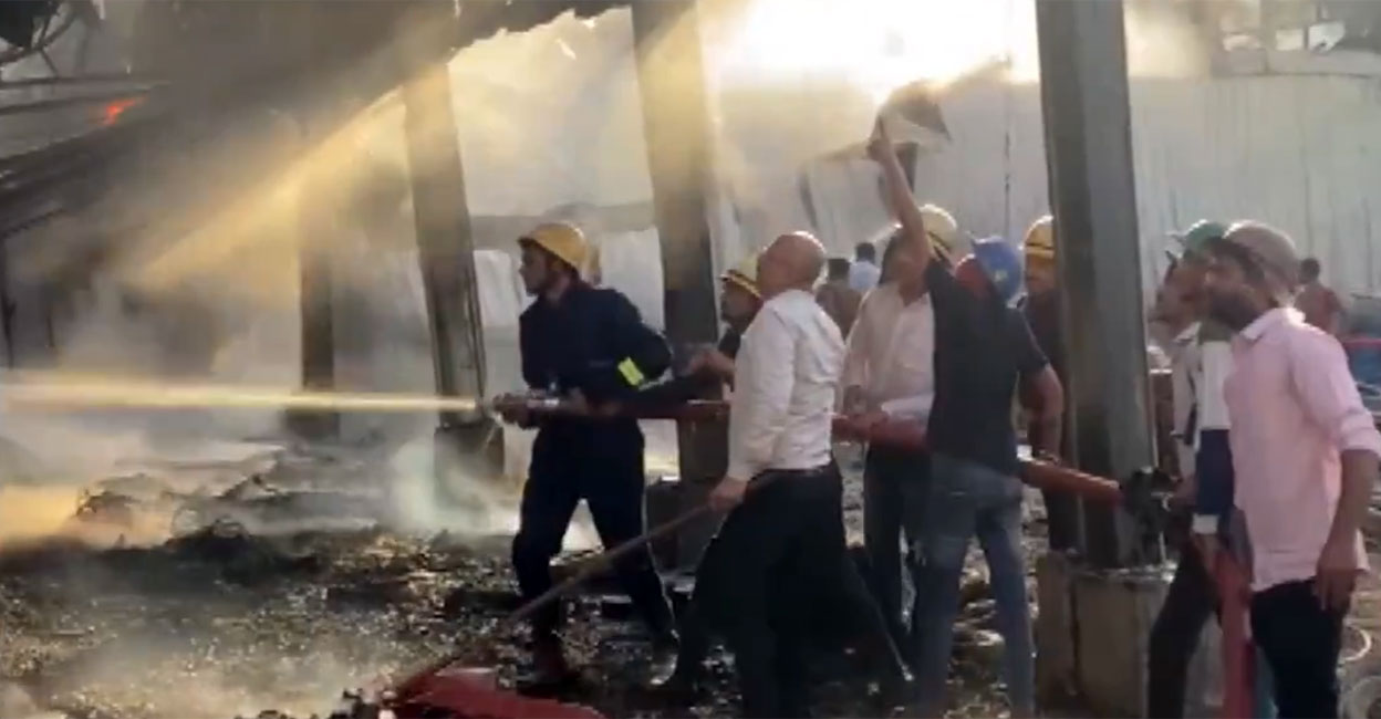 Fire & Rescue personnel attempt to douse the fire. Photo: Screengrab/PTI