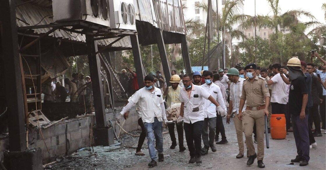 rajkot-ls Rescuers carry a dead body of a person killed in a fire which broke out in a fun park, in Rajkot in the Indian state of Gujarat, Saturday, May 25, 2024. File Photo: PTI.