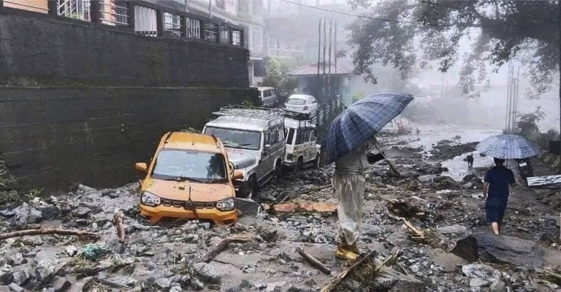 Vehicles stuck in mud and silt following landslides triggered by incessant rainfall, in North Sikkim, Thursday, June 13, 2024. Photo: PTI. 