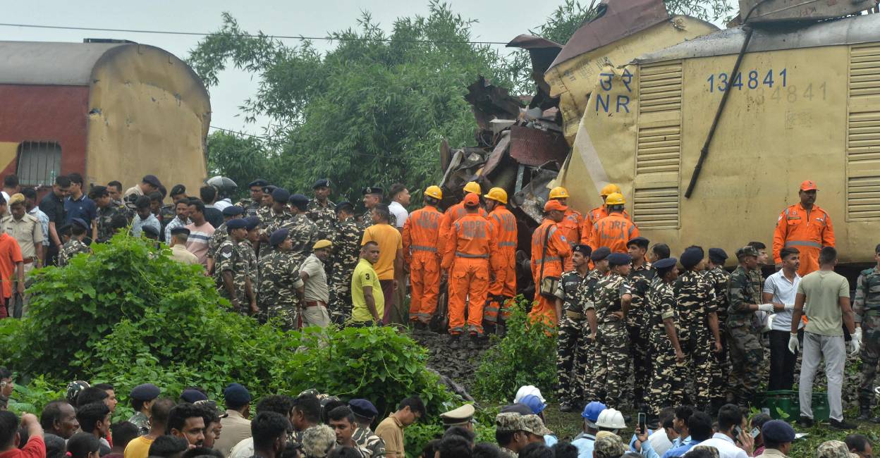 National Disaster Response Force (NDRF) and security personnel at the site where a goods train rammed into Kanchanjunga Express train. Photo: AFP