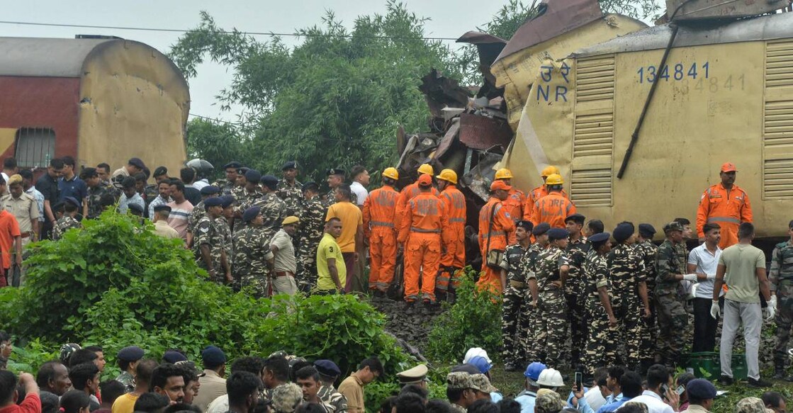 National Disaster Response Force (NDRF) and security personnel at the site where a goods train rammed into Kanchanjunga Express train. Photo: AFP