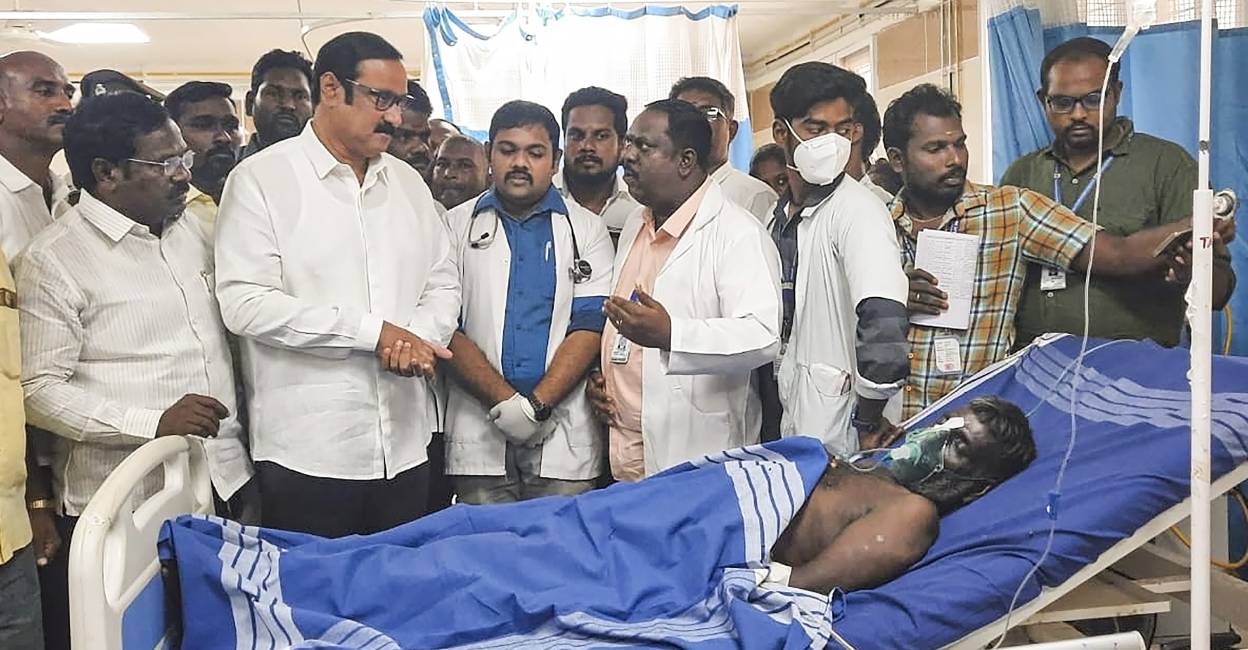 Former union minister Anbumani Ramadoss speaks with medics at a government hospital where people who consumed spurious liquor are being treated, in Kallakurichi. Photo: PTI